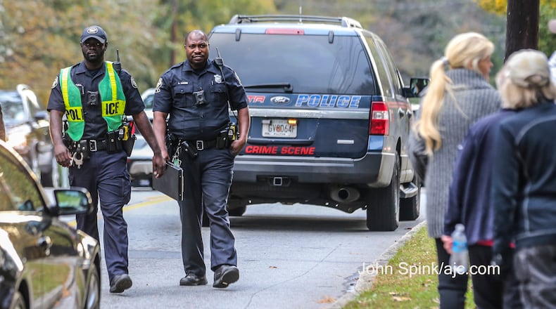 An officer was hit early Thursday by a vehicle in front of Pace Academy in Buckhead, Atlanta police said.