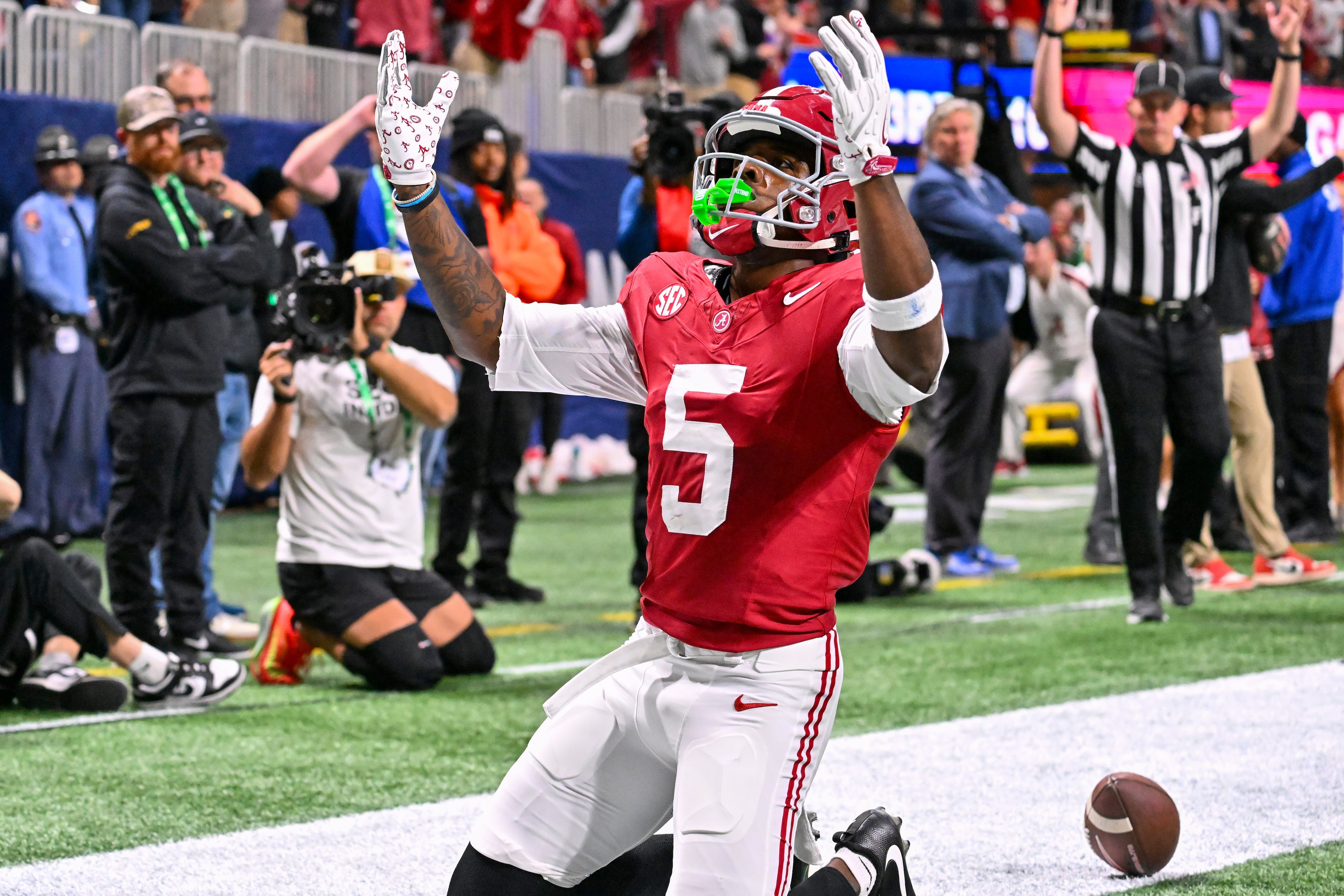 Alabama wide receiver Germie Bernard (5) scores against Georgia on a pass for a 23 yard touchdown during the fourth quarter of the SEC Championship game at Mercedes-Benz Stadium, Saturday, Dec. 6, 2025, in Atlanta. (Hyosub Shin / AJC)