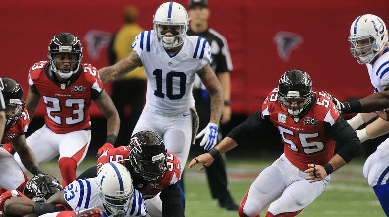 Falcons linebacker Paul Worrilow (far right) recovers a fumble by Colts running back Frank Gore as he is tackled by Falcons defenders during the first period in a football game on Sunday, Nov. 22, 2015, in Atlanta. Curtis Compton / ccompton@ajc.com