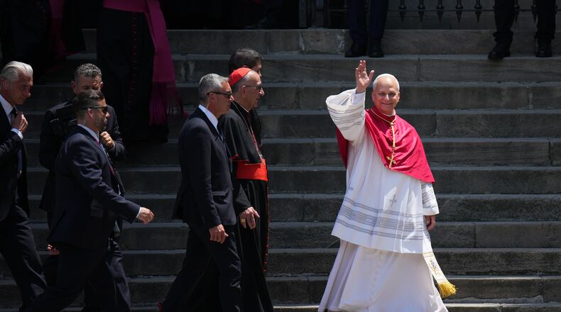 Pope Leo XIV waves to the cheering crowd after attending a midday prayer at the Cathedral of the Holy Cross and Saint Eulalia in Barcelona, Spain, Tuesday, June 9, 2026. (AP Photo/Emilio Morenatti)