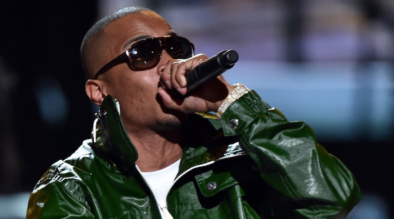 LOS ANGELES, CA - JUNE 29: Rapper T.I. performs onstage during the BET AWARDS '14 at Nokia Theatre L.A. LIVE on June 29, 2014 in Los Angeles, California. (Photo by Kevin Winter/Getty Images for BET) T.I. will be at V_103's Car and Bike Show. Here he is at the BET Awards from June 29. CREDIT: Getty Images.