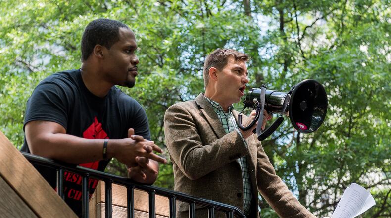 Bryan Long (right), executive director of Better Georgia, speaks during the "die-in" protest at Woodruff Park in Atlanta in 2017. Cory Hancock/AJC file