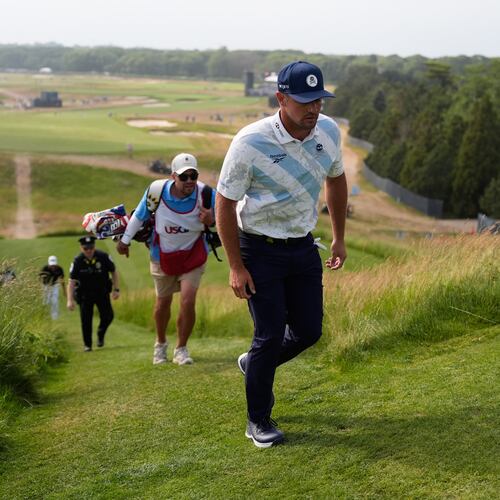 Bryson DeChambeau walks to the tee on the 15th hole during the first round of the U.S. Open golf tournament at Shinnecock Hills Golf Club in Southampton, N.Y., Thursday, June 18, 2026.(AP Photo/George Walker IV)