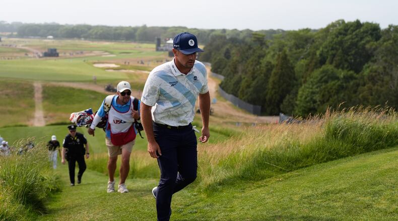 Bryson DeChambeau walks to the tee on the 15th hole during the first round of the U.S. Open golf tournament at Shinnecock Hills Golf Club in Southampton, N.Y., Thursday, June 18, 2026.(AP Photo/George Walker IV)
