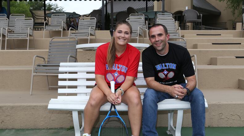 Liz Norman (left) and her coach Anthony Foti (right) pose for a portrait at the Olde Towne Athletic Club tennis courts in Marietta, Georgia, on May 12, 2017. After being shifted up to Class AAAAAAA, the Walton High School girl’s tennis team stepped up and won the state championship, while Norman herself went undefeated in a 17-0 season. She was recently ranked as the 53rd tennis player in the United States for her class, and as a five star recruit will attend James Madison University in the fall. (HENRY TAYLOR / HENRY.TAYLOR@AJC.COM)