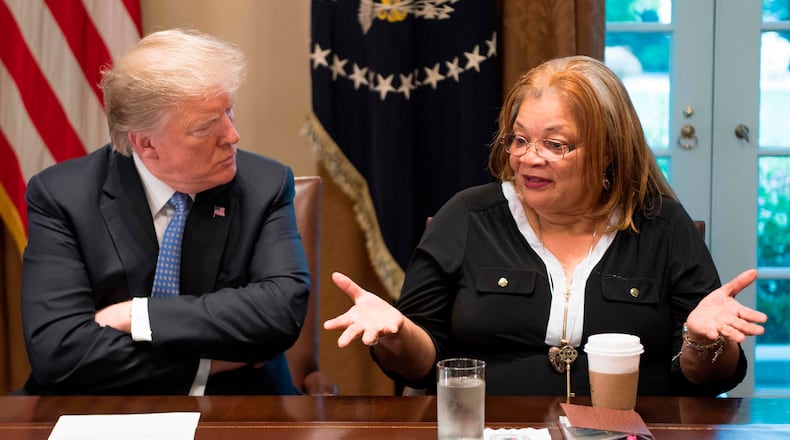 President Donald Trump listens to  Alveda King, niece of Dr. Martin Luther King Jr., during a meeting with inner city pastors at the White House in  2018. King was also  one of  about 20 faith leaders who met with Trump this week.