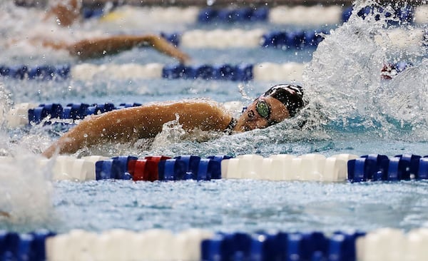 FILE - Georgia's Olivia Smoliga swims to a first-place finish in the 100-yard freestyle at the NCAA women's swimming and diving championships at Georgia Tech, March 19, 2016, in Atlanta. (AP Photo/David Goldman, File)