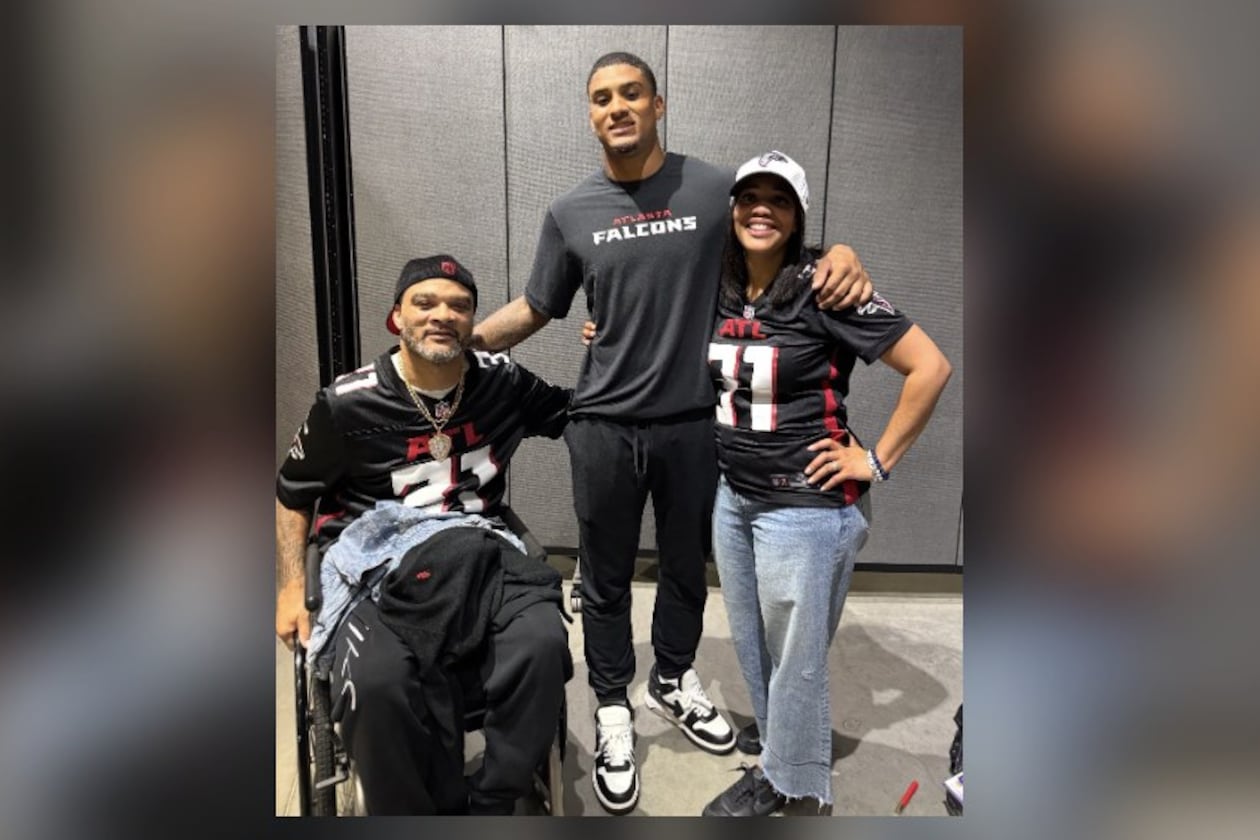 Falcons safety Xavier Watts (center) has succeeded with the help of his father, Jeff (left), and his mother, Fallon. (Courtesy of the Watts family)