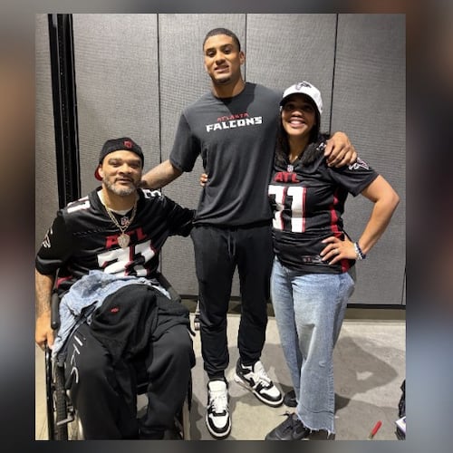 Falcons safety Xavier Watts (center) has succeeded with the help of his father, Jeff (left), and his mother, Fallon. (Courtesy of the Watts family)