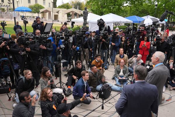 Attorney Mark Geragos, right, representing Erik and Lyle Menendez, who were sentenced in 1996 to life in prison without the possibility of parole for fatally shooting their parents, speaks to the media outside of court after a resentencing hearing in their case, Thursday, April 17, 2025, in Los Angeles. (AP Photo/Damian Dovarganes)