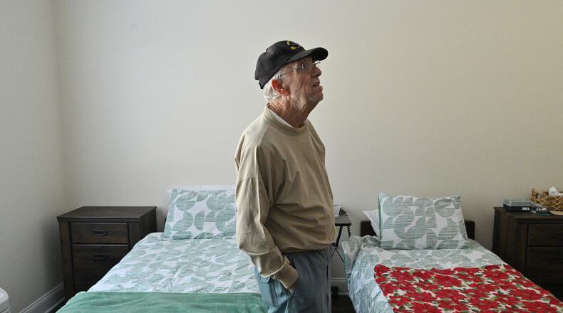 Frank Carroll, former resident at Tranquil Gardens, stands in his new room at Brickmont of Acworth, an Assisted Living and Alzheimer's Care facility. Tranquil Gardens Assisted Living and Memory Care facility in Acworth abruptly announced it was closing its doors, giving the 27 residents and their families less than 72 hours to make other arrangements. (Hyosub Shin / Hyosub.Shin@ajc.com)