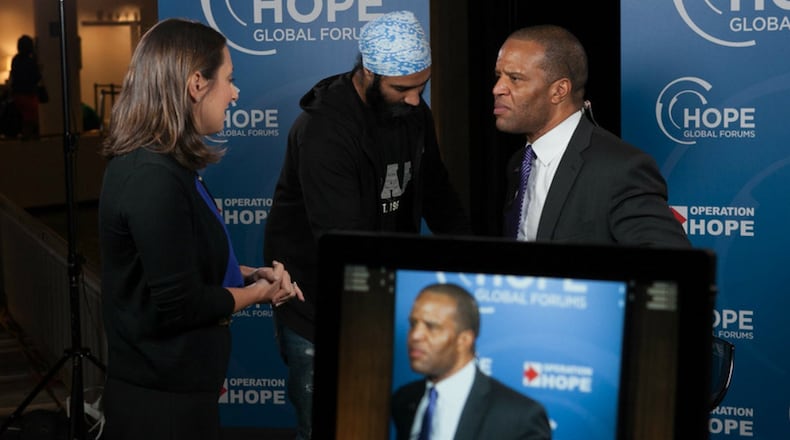 John Hope Bryant (right) is the chief executive officer of Atlanta-based Promise Homes.