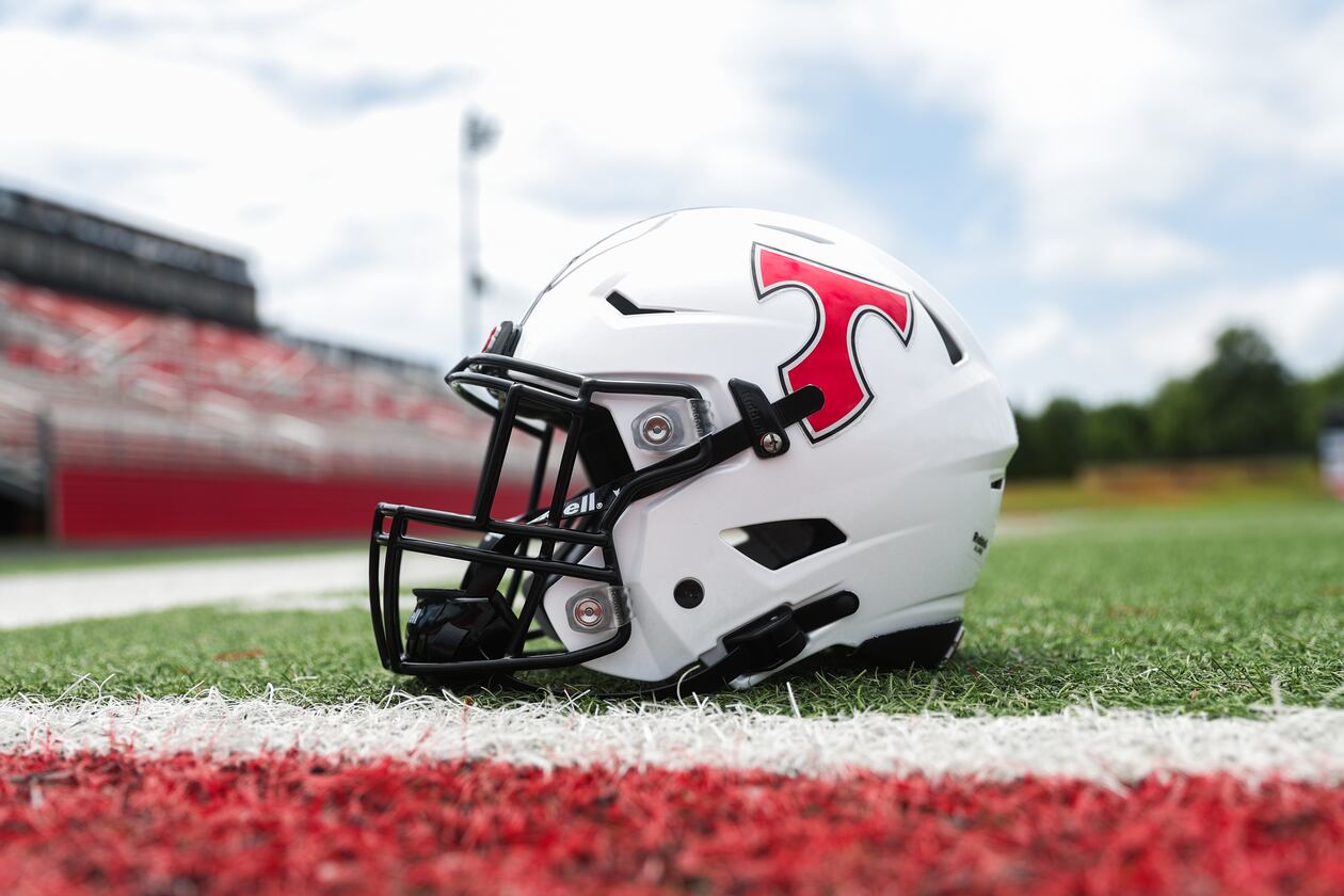 A football helmet sits on the field at North Oconee High School in Bogart, Georgia, on Wednesday, July 30, 2025. (Abbey Cutrer/AJC)
