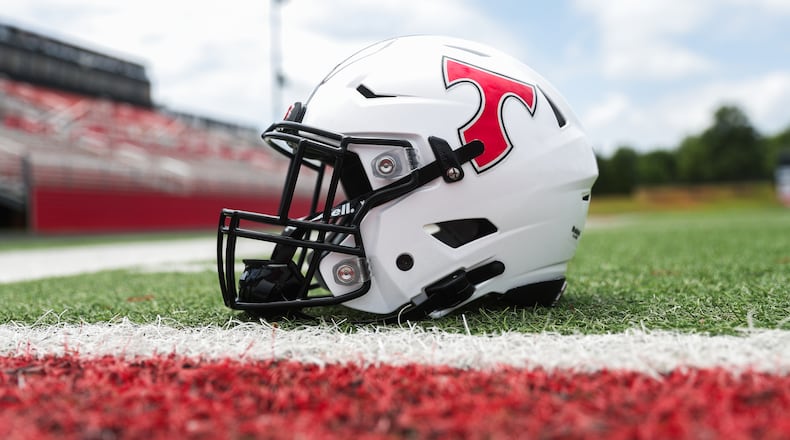 A football helmet sits on the field at North Oconee High School in Bogart, Georgia, on Wednesday, July 30, 2025. (Abbey Cutrer/AJC)