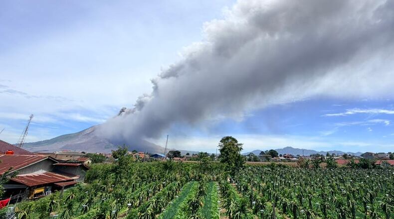 In this photo released by the Geological Agency (Badan Geologi) of Indonesia's Ministry of Energy and Mineral Resources, Mount Sinabung releases volcanic materials into the air during an eruption in Karo, North Sumatra, Indonesia, Monday, Aug. 31, 2026. (Badan Geologi via AP)