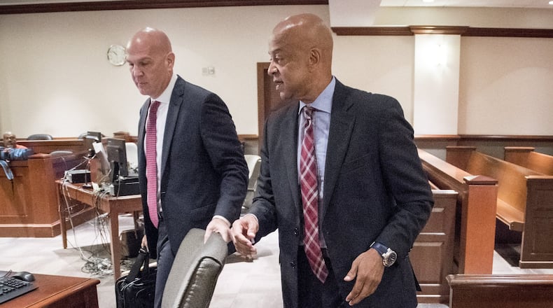 DeKalb Sheriff Jeff Mann, right, and attorney Noah Pines arrive for a hearing to plead not guilty in Atlanta Municipal Court on Friday. Mann was arrested and charged in Piedmont Park on May 6 for exposing himself and running from police. (JOHN AMIS)