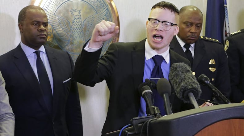 Sir Maejor Page (middle) was arrested Friday after authorities said he used donations intended for the Black Lives Matter movement to buy tailored suits, guns and a home in Ohio. This 2016 photo shows Page along with then-Mayor Kasim Reed (left) and Police Chief George Turner after Reed met with Black Lives Matter protesters. (AJC File Photo BOB ANDRES / BANDRES@AJC.COM)