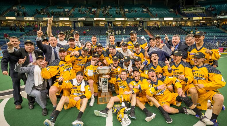 The Georgia Swarm celebrate winning the National Lacrosse League championship Saturday night in the SaskTel Centre in Saskatoon, Saskatchewan, on Saturday night. Miles Thompson scored the game-winner in overtime for a 15-14 victory over the Saskatchewan Rush as the Swarm took the best-of-three series 2-0. (PHOTO CREDIT: Josh Schaefer/GetMyPhoto.ca)