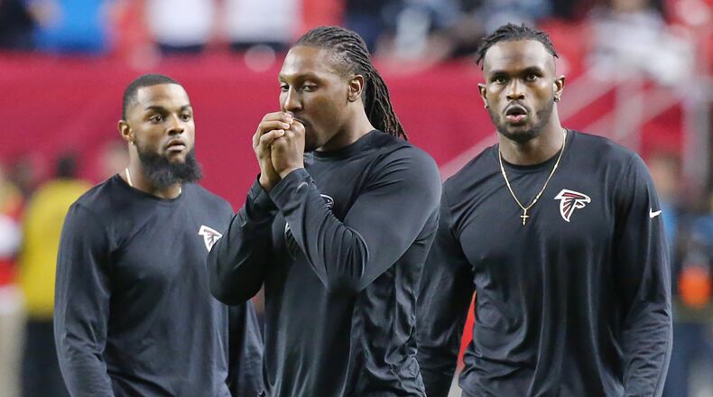 Falcons wide receivers Justin Hardy (from left), Roddy White, and Julio Jones prepare to play the Panthers in a football game on Sunday, Dec. 27, 2015, in Atlanta.