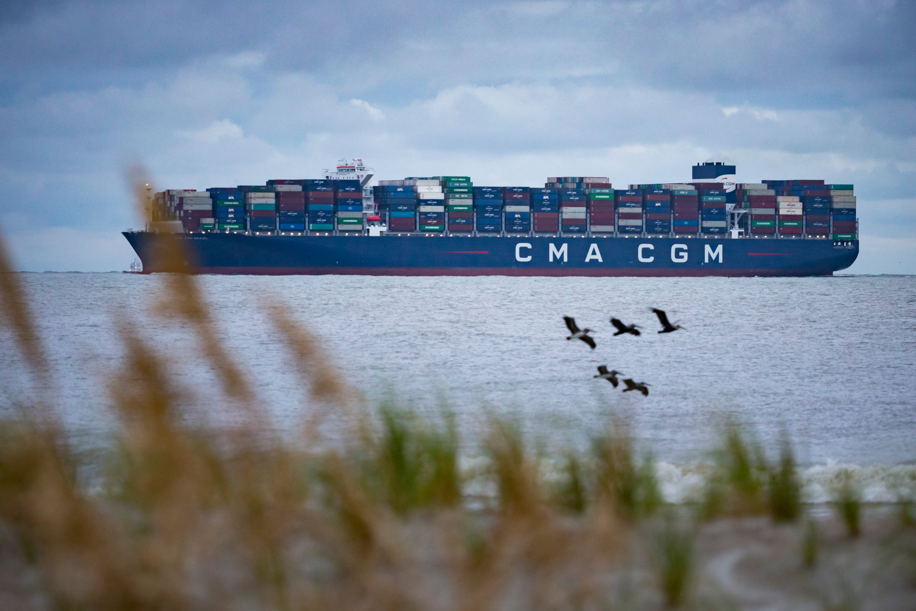 TYBEE ISLAND, GA - SEPTEMBER 18, 2020: The CMA CGM Brazil, one of the largest container ships to call on the U.S. East Coast, sails past past the North Beach of Tybee Island to the mouth of the Savannah River in route to the Georgia Ports Authority's Garden City Terminal, Friday, Sept., 18, 2020, in Tybee Island, Ga. (AJC Photo/Stephen B. Morton)