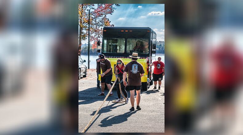 After receiving a lung cancer diagnosis, Christy Erickson of Macon resolved to live out her fantasy of pulling a UPS truck in a Strongman competition. (Photo provided by Christy Erickson)
