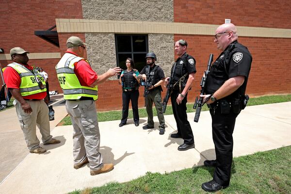 Cherokee County Sheriff’s Office conducts a training exercise at Mill Creek middle school Wednesday, June 8, 2022, in Woodstock, Ga. The training exercise was an active shooter drill to prepare officers to respond to school shootings. This training exercise was staged and students were volunteered to act during the exercise. (Jason Getz / Jason.Getz@ajc.com)