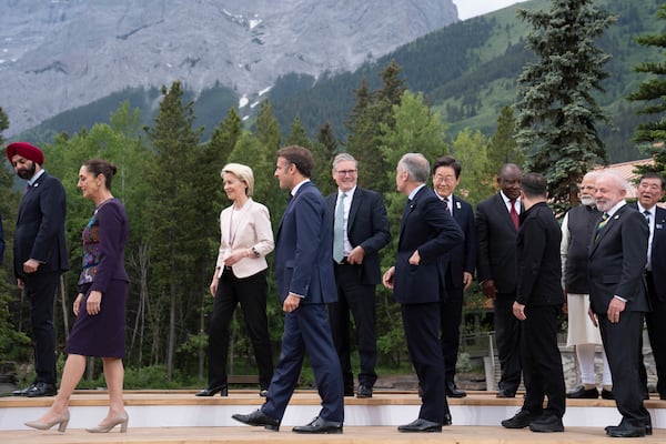 FILE - President of the World Bank Group Ajay Banga, from left, President of Mexico Claudia Sheinbaum, Presdent of the European Commission Ursula von der Leyen, President of France Emmanuel Macron, Britain's Prime Minister Keir Starmer, Canada's Prime Minister Mark Carney, South Korean President Lee Jae-myung, President of South Africa Cyril Ramaphosa, President of Ukraine Volodymyr Zelenskyy, Prime Minister of India Narendra Modi, President of Brazil Luiz Inacio Lula da Silva and Prime Minister of Japan Shigeru Ishiba during a family photo at the G7 leaders' summit in Kananaskis, Alberta, Tuesday, June 17, 2025. (Stefan Rousseau/Pool Photo via AP, File)