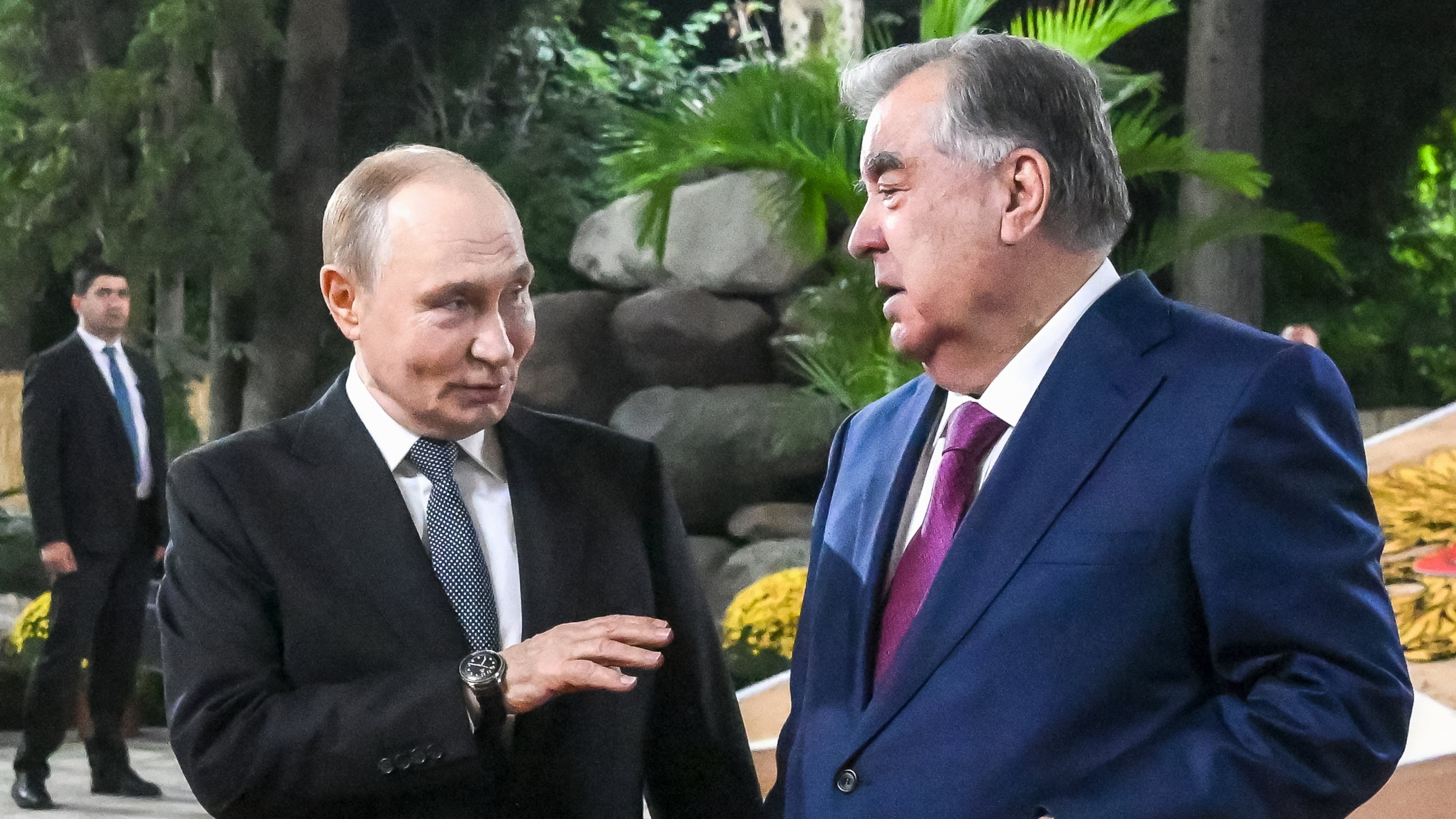 Russian President Vladimir Putin, left, speaks with Tajik President Emomali Rahmon while walking at Iram botanical garden in Dushanbe, Tajikistan, Wednesday, Oct. 8, 2025. (Grigory Sysoyev, Sputnik, Kremlin Pool Photo via AP)