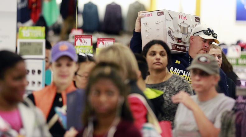 November 25, 2016 - East Cobb - Black Friday shoppers wait to check out at Kohl’s in East Cobb. Kohl’s was among retailers opening Thursday evening and staying open until midnight Friday, nearly 30 hours later. BOB ANDRES /BANDRES@AJC.COM