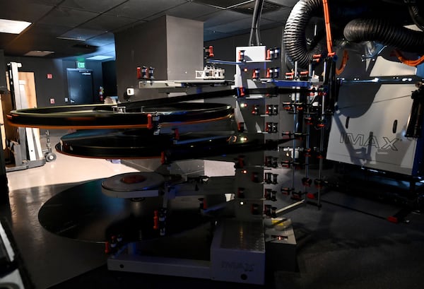 An IMAX 70mm film projector shows “The Odyssey” inside the Regal Mall of Georgia on Friday, Aug. 7, 2026. Some IMAX screenings have been booking out weeks in advance. (Hyosub Shin/AJC)