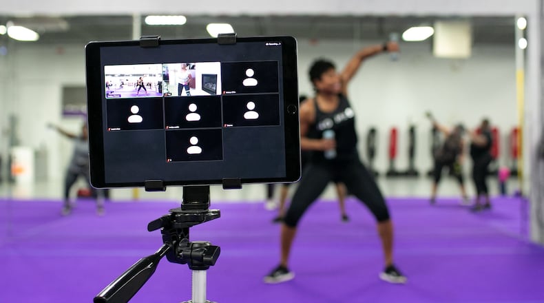 LaTasha Lewis, owner of Tadda Fitness in Decatur, Georgia, at her fitness studio on Thursday. Since the coronavirus pandemic, Lewis has had to adjust how she trains her clients, such as implementing social distancing in the studio, offering Zoom workout classes and ensuring her clients are healthy before coming in for a workout.Rebecca Wright for The Atlanta Journal-Constitution