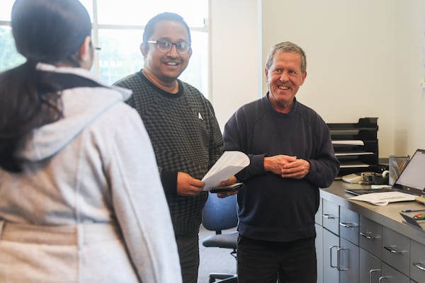 Founder David England helps customers at England Piano as he liquidates inventory after a 52-year-run. (Abbey Cutrer/AJC)