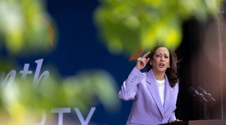 Vice President Kamala Harris speaks June 18 at a Juneteenth Block Party campaign event outside her new campaign headquarters in Atlanta. (Arvin Temkar/The Atlanta Journal-Constitution)