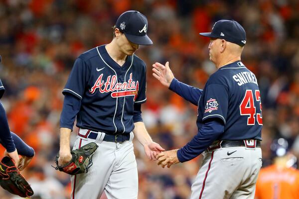10/27/21 - Houston - Atlanta Braves starting pitcher Max Fried, left, is removed from the mound by manager Brian Snitker during the sixth inning against the Houston Astros in game 2 of the World Series at Minute Maid Park, Wednesday October 27, 2021, in Houston, Tx. Curtis Compton / curtis.compton@ajc.com 