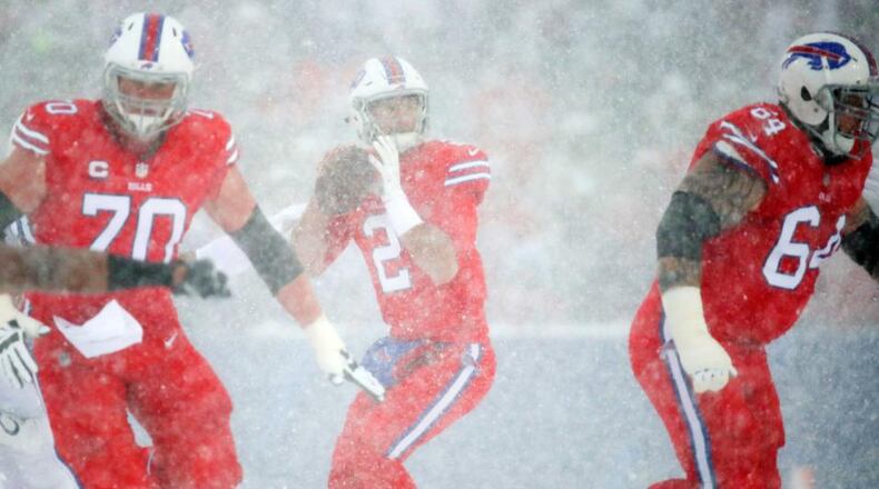 Buffalo quarterback Nathan Peterman tries to throw a pass during the second quarter Sunday. Snowy conditions made visibility difficult during the game.