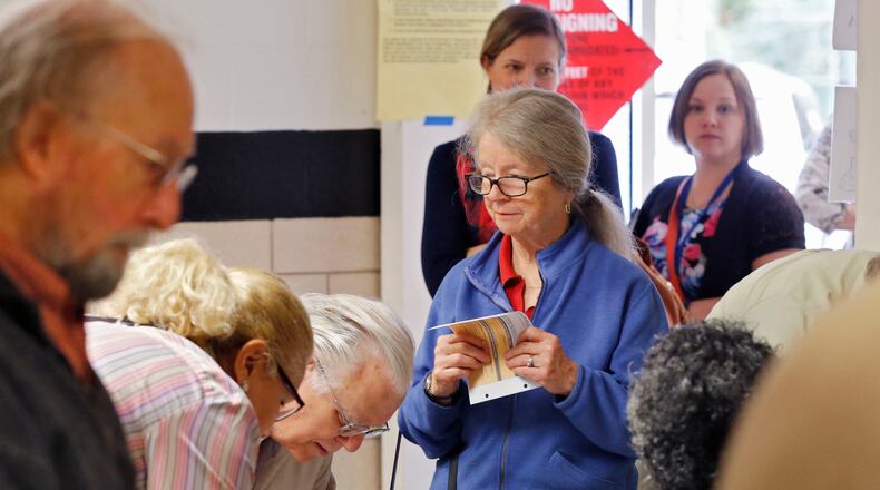 Nov. 3, 2015 - DeKalb County - A line of voters wait to sign in at Hawthorne Elementary, where city hood for LaVista Hills was on the ballot, with 275 voters by 11am. DeKalb County residents could vote on an ethics overhaul for the county and city hood for LaVista Hills and Tucker. Hawthorne Elementary is one of the busiest precincts in DeKalb, where voters will consider overhauling the county's ethics rules and city hood for LaVista Hills. BOB ANDRES / BANDRES@AJC.COM