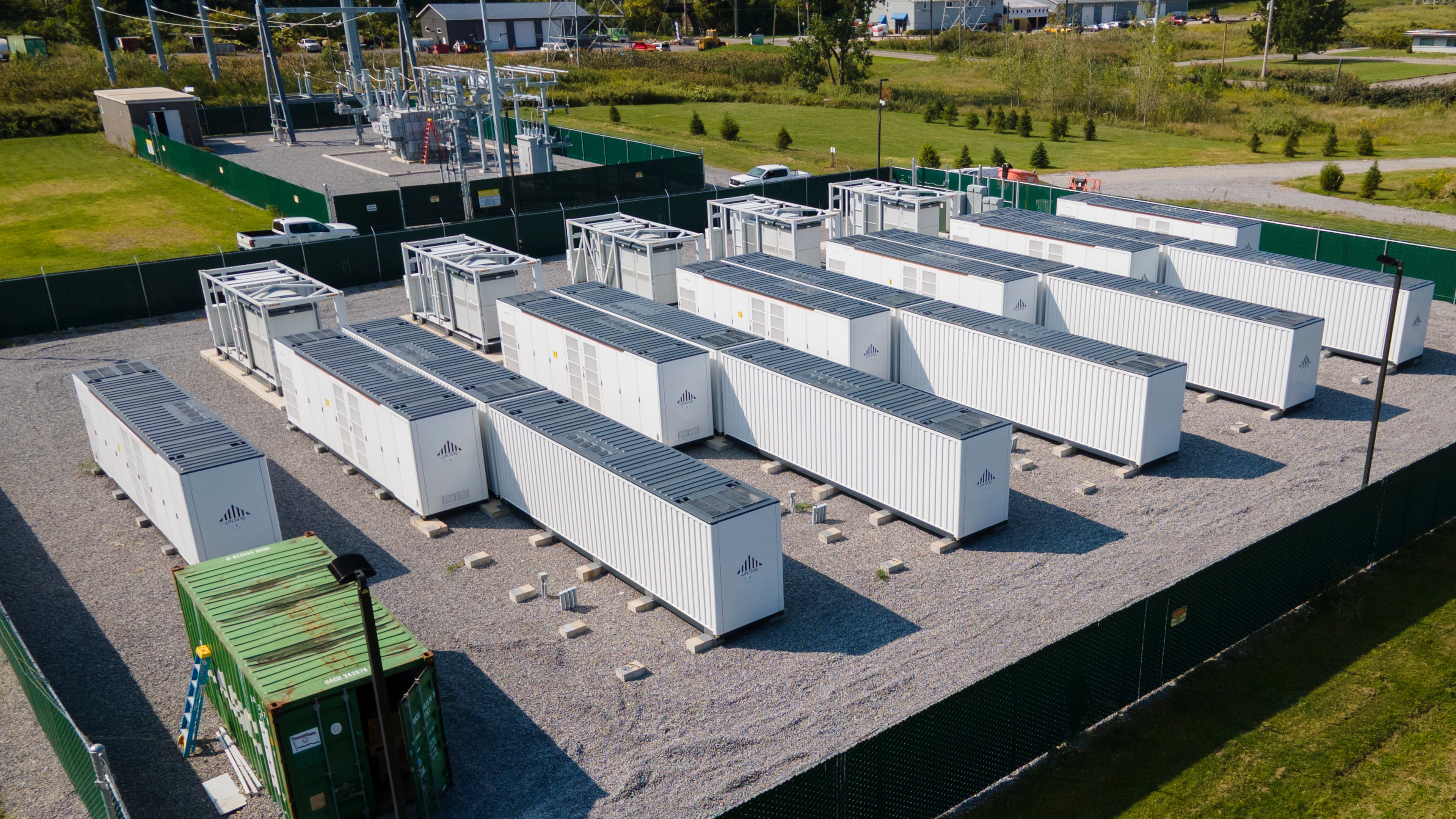 A large lithium battery energy storage system operated by Key Capture Energy that can power 15,000 homes for two hours during outages or high demand sits surrounded by a fence in Blasdell, N.Y., Tuesday, Sept. 9, 2025. (AP Photo/Ted Shaffrey)