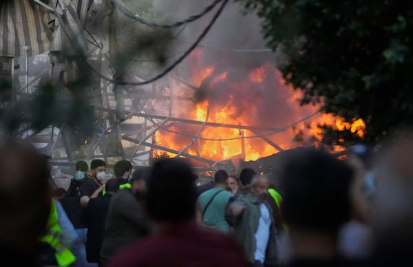 Flames rise from a metal tent that was hit by an Israeli airstrike on Dahiyeh in the southern suburb of Beirut, Lebanon, Sunday, April 27, 2025. (AP Photo/Hussein Malla)