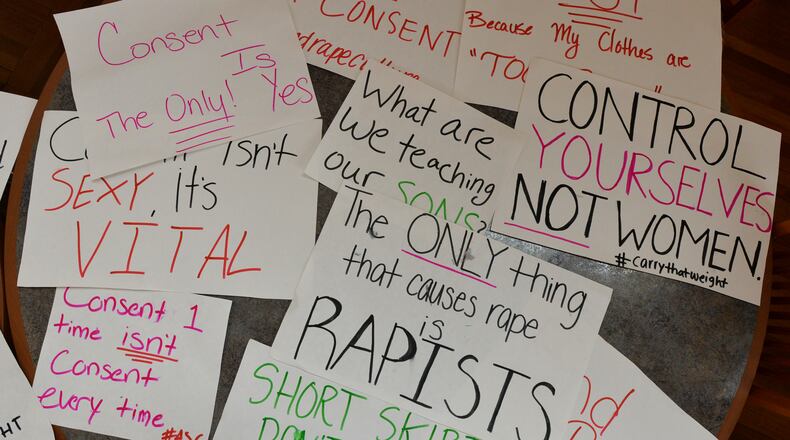 Students at Agnes Scott College show their support for sexual assault victims as part of a 2014 national day of action. BRANT SANDERLIN / BSANDERLIN@AJC.COM