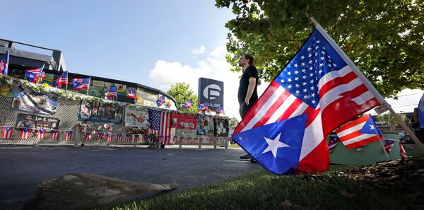 Orlando resident Jakob Strawn reflects on the scene at the Pulse nightclub shooting site in Orlando on the 9th anniversary of the 2016 massacre that killed 49, Thursday, June 12, 2025, Orlando, Fla. (Joe Burbank/Orlando Sentinel via AP)