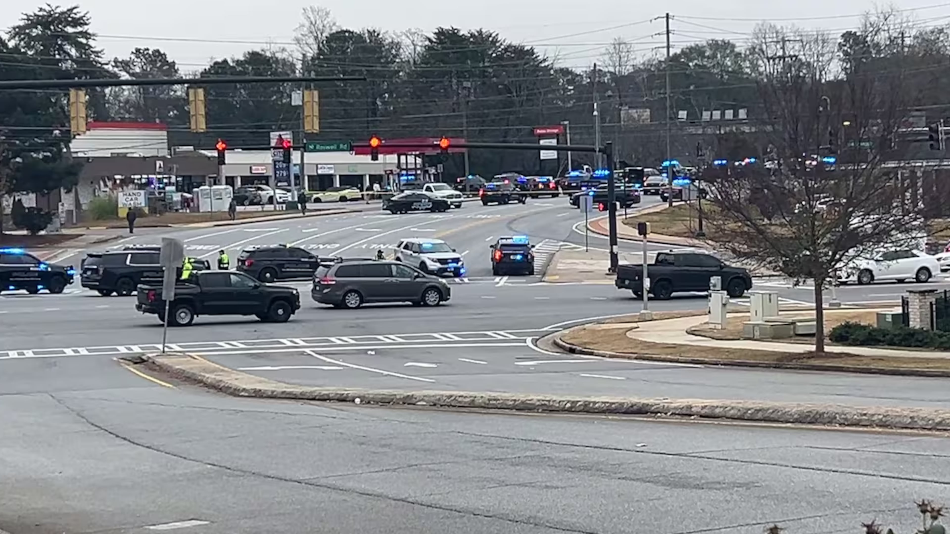 A person was injured following an officer-involved shooting that led to a large police presence in Sandy Springs on Thursday, authorities said. (Channel 2 Action News)