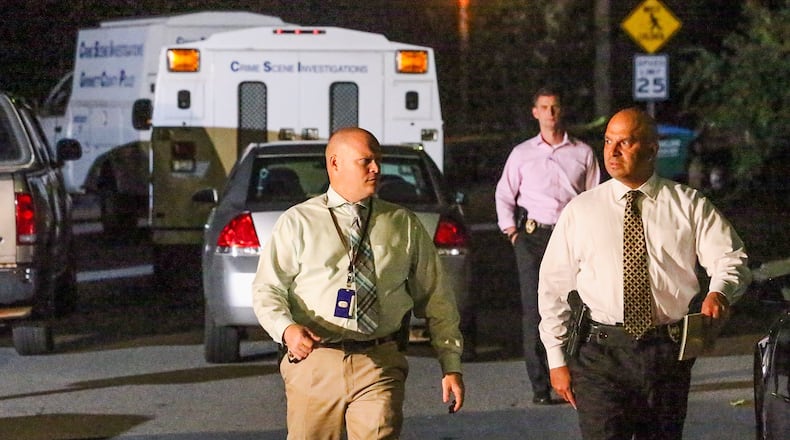 Gwinnett police investigated a fatal shootout near Norcross on Thurs., Sept. 24, 2015. JOHN SPINK / JSPINK@AJC.COM