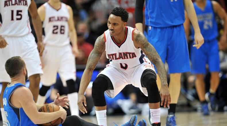 February 25, 2015 Atlanta - Atlanta Hawks guard Jeff Teague (0) reacts after he was fouled by Dallas Mavericks guard J.J. Barea (5) in a basketball game at Philips Arena in Atlanta on Wednesday, February 25, 2015. HYOSUB SHIN / HSHIN@AJC.COM