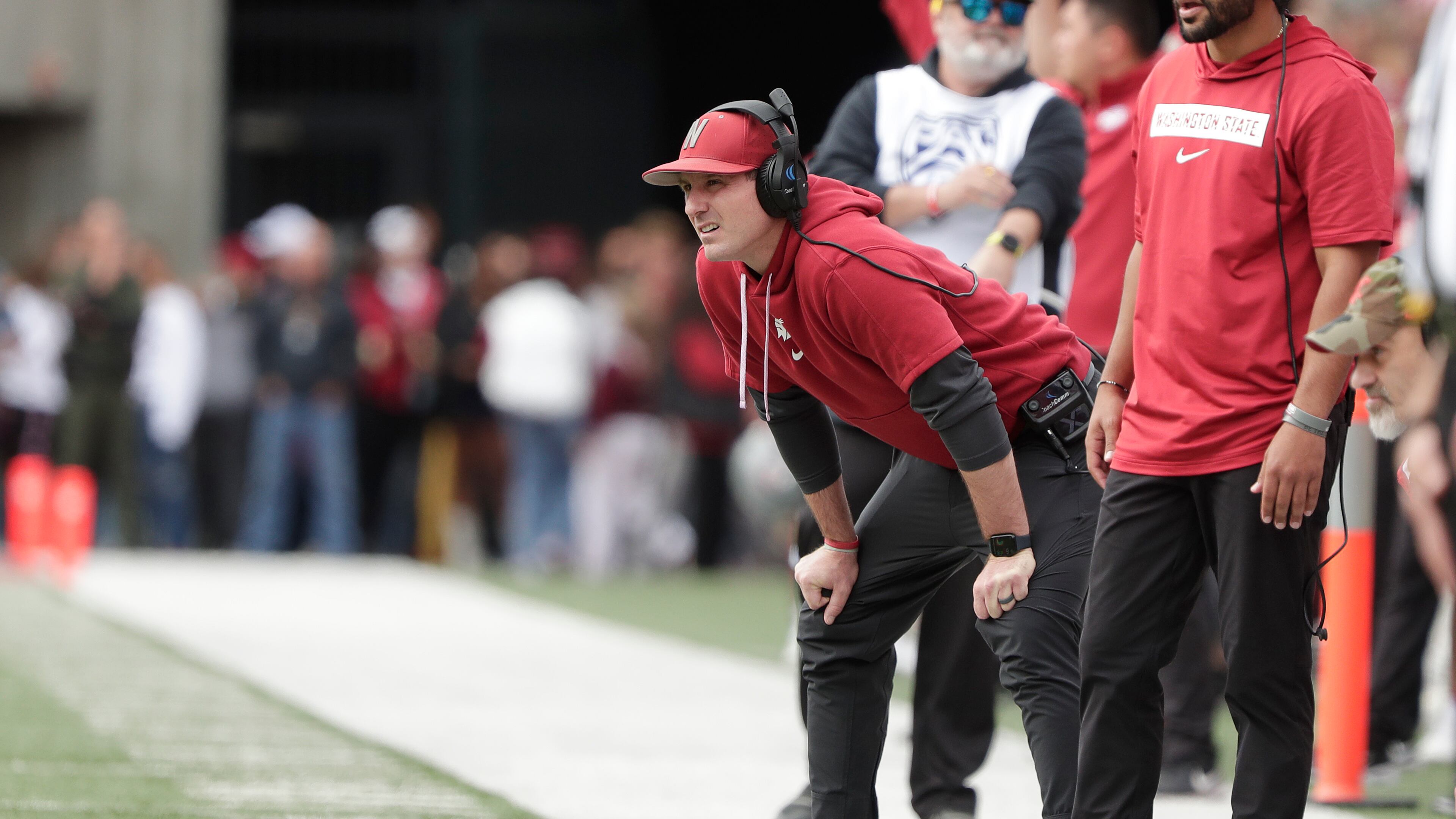 FILE - Washington State head coach Jake Dickert, center, watches the first half of an NCAA college football game, Saturday, Oct. 19, 2024, in Pullman, Wash. (AP Photo/Young Kwak, File)