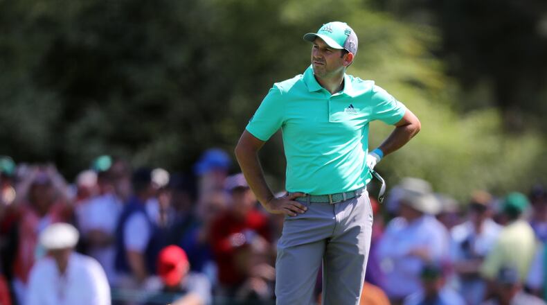 Sergio Garcia reacts after he hit four shots into the pond on 15. during the first round of the Masters at Augusta National Golf Club on Thursday, April 5, 2018, in Augusta. Curtis Compton/ccompton@ajc.com