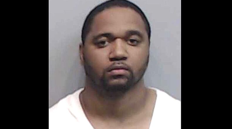 Kenndric Traman Roberts, 33, is accused of forcing women to have plastic surgery, get matching tattoos and dance at strip clubs, according to police. (Photo: Fulton County Sheriff’s Office)