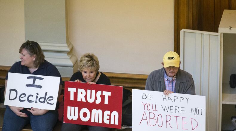 Demonstrators oppose and support a bill in 2019 seeking a ban on abortions in Georgia once fetal cardiac activity can be detected. The measure, which won passage in the House that year by one vote, may have to go back through the legislative process again, after a Fulton County Superior Court judge this past week ordered an end to its enforcement, (ALYSSA POINTER/ALYSSA.POINTER@AJC.COM)