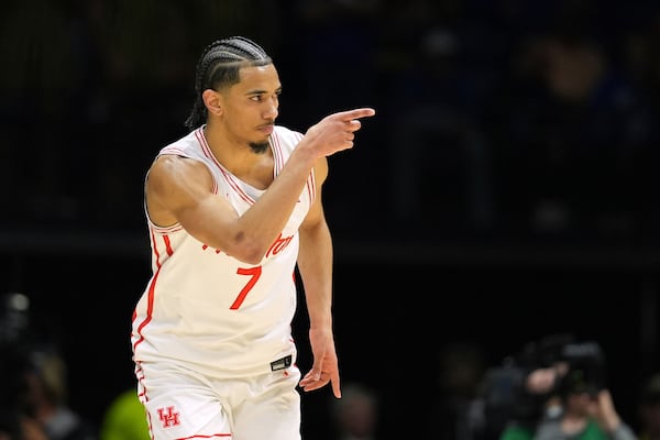 Houston's Milos Uzan points during the second half in the Sweet 16 of the NCAA college basketball tournament against Purdue Saturday, March 29, 2025, in Indianapolis. (AP Photo/Michael Conroy)
