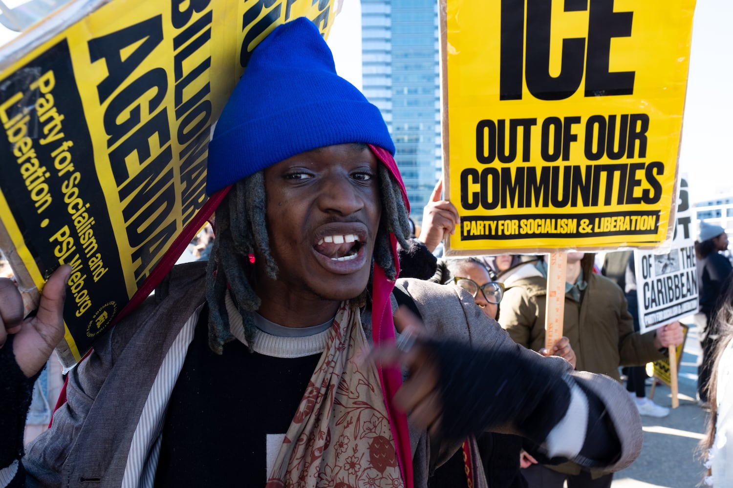 Michael “Overpade” Malachi chants along with others on the 17th Street Bridge in Atlanta on Sunday, Jan. 11, 2026 during a protest against the ICE shooting of Renee Good and the US military action in Venezuela. Ben Gray for the Atlanta Journal-Constitution