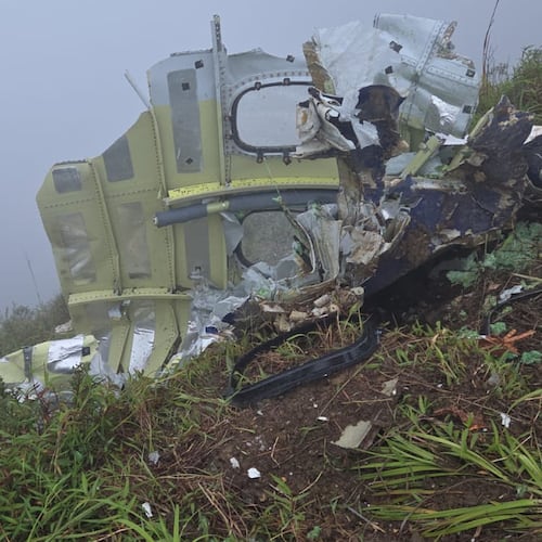 This photo provided by the Indonesian National Search and Rescue Agency (BASARNAS) shows debris of an ATR 42-500 turboprop airplane at Mount Bulusaraung in South Sulawesi province, Indonesia, Sunday, Jan. 18, 2026, after the aircraft lost contact Saturday. (BASARNAS via AP)